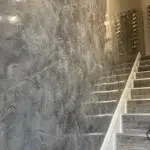 Image of Stair Wall finished with Decoveno Dark Grey Venetian Plaster