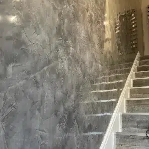 Image of Stair Wall finished with Decoveno Dark Grey Venetian Plaster