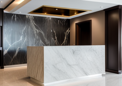 Image of a reception desk finished with a white and grey marble venetian plaster finish along with a black and white veined venetian plaster wall