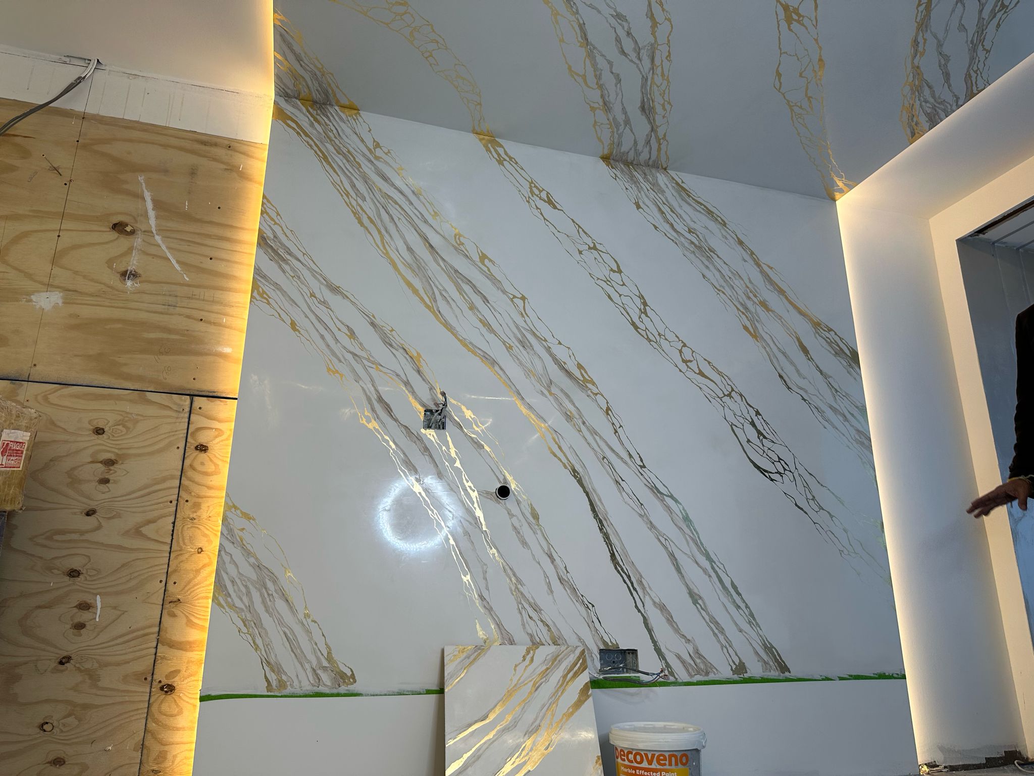 Image of a Decoveno Marble Wall with Gold Leaf Veins created by Decomin Paints