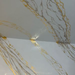 Image of a Decoveno Marble Wall with Gold Leaf Veins created by Decomin Paints