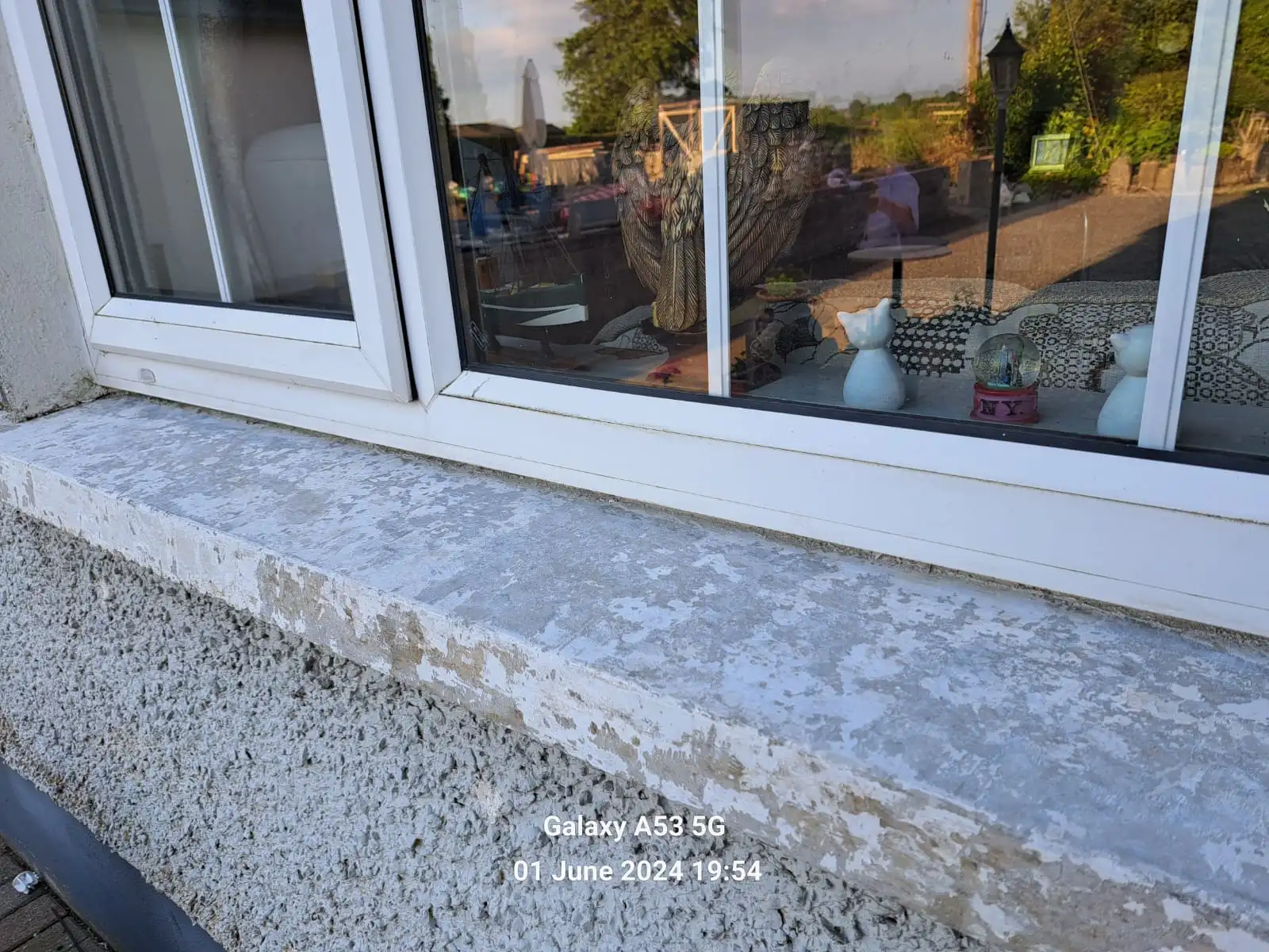 Image of a concrete window sill with flaky paint before it is refurbished with Decosill Granite Window Sill render