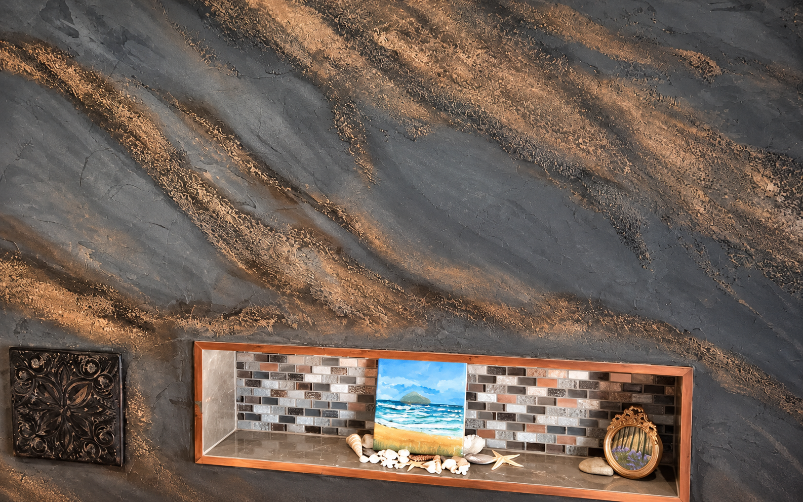 Pietra Spaccata wall with charcoal trowelled areas and irregular bronze fractured texture